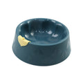 Green plastic double pet bowl with flower-shaped base for cat or small dog food and water.