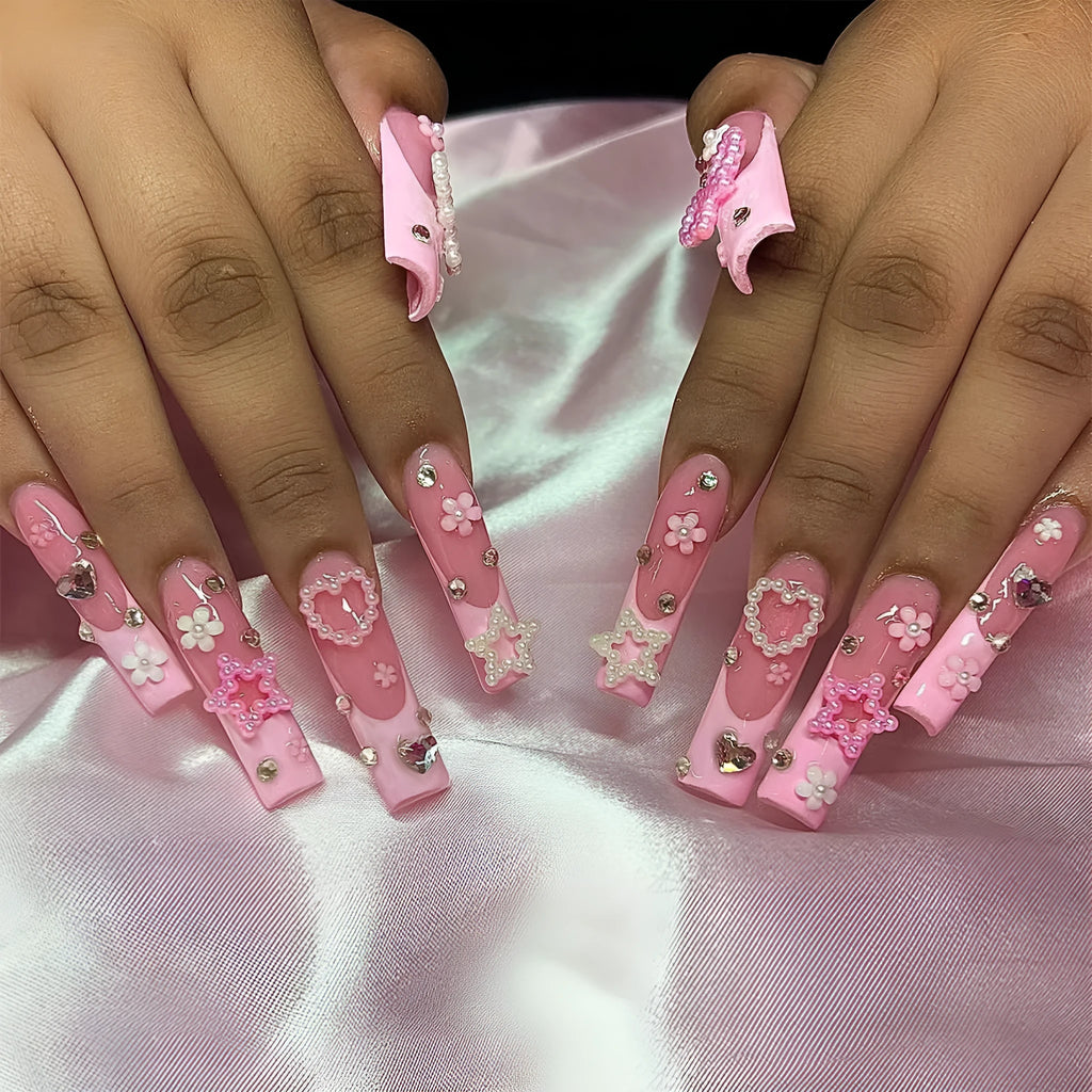 Water transfer nail art stickers with long pipe and bow design next to a plastic armour suit applicator.