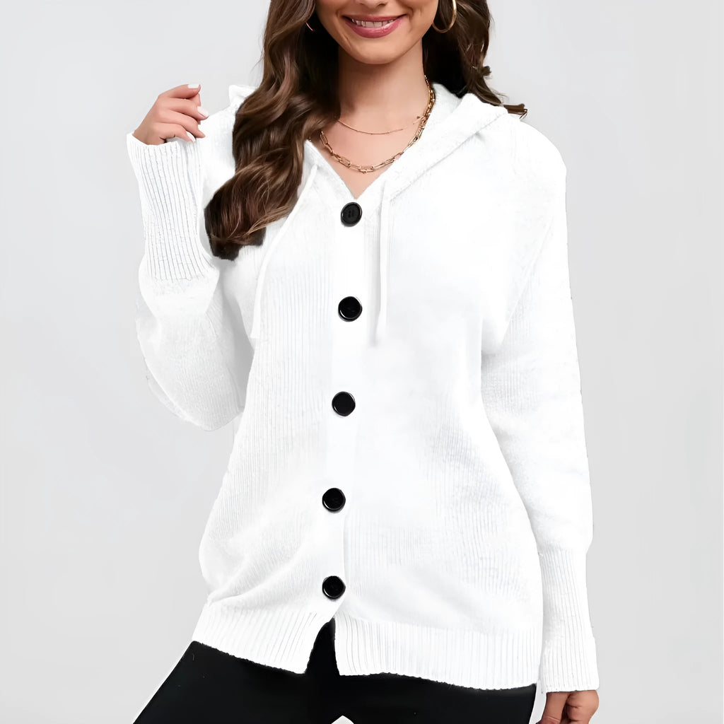 Woman wearing a loose-fit, thick cotton hooded cardigan sweater in a solid colour.