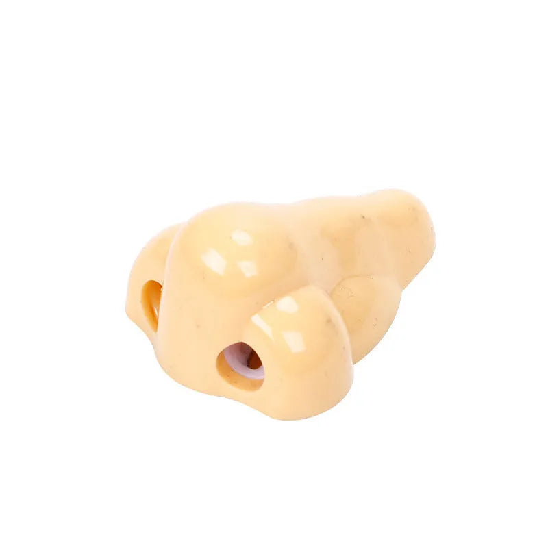 Flesh-coloured plastic pencil sharpener with dual holes for different pencil sizes