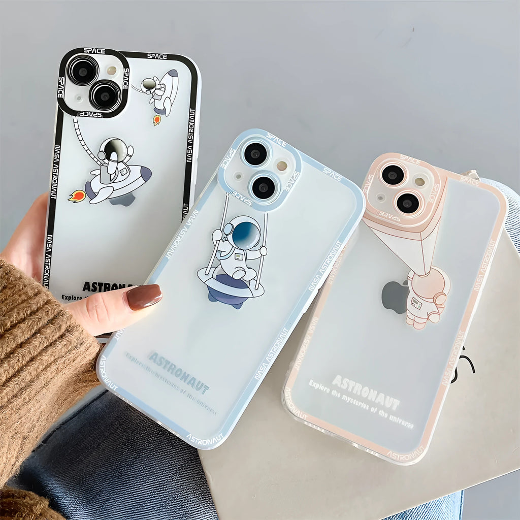 Silicone transparent iPhone case with astronaut print in black, blue, and pink colours