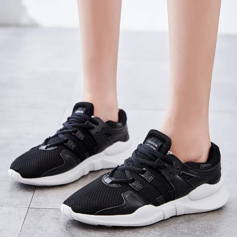 Men's black mesh casual sneakers with hollow breathable design and low-top cut