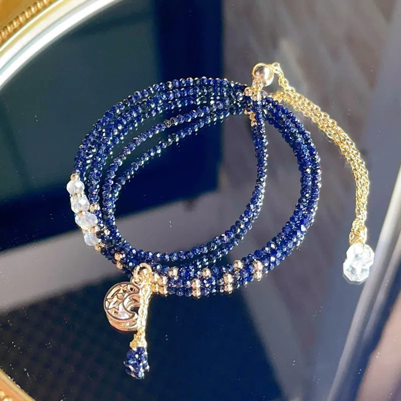 Women's blue and gold three-ring multi-layer bracelet with sand stone beads.