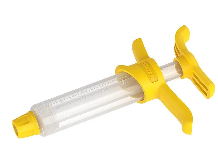 EZmtb bicycle hydraulic brake bleed kit showing syringes, metal fittings, adapters, and tools on a workbench.