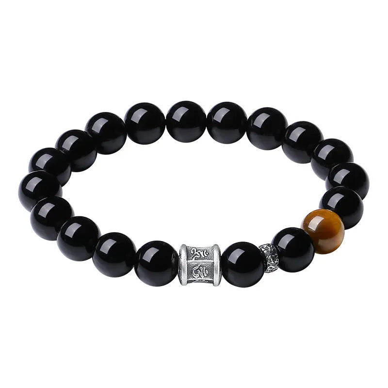 Men's obsidian and pure silver bracelet with six-word mantra prayer wheel design