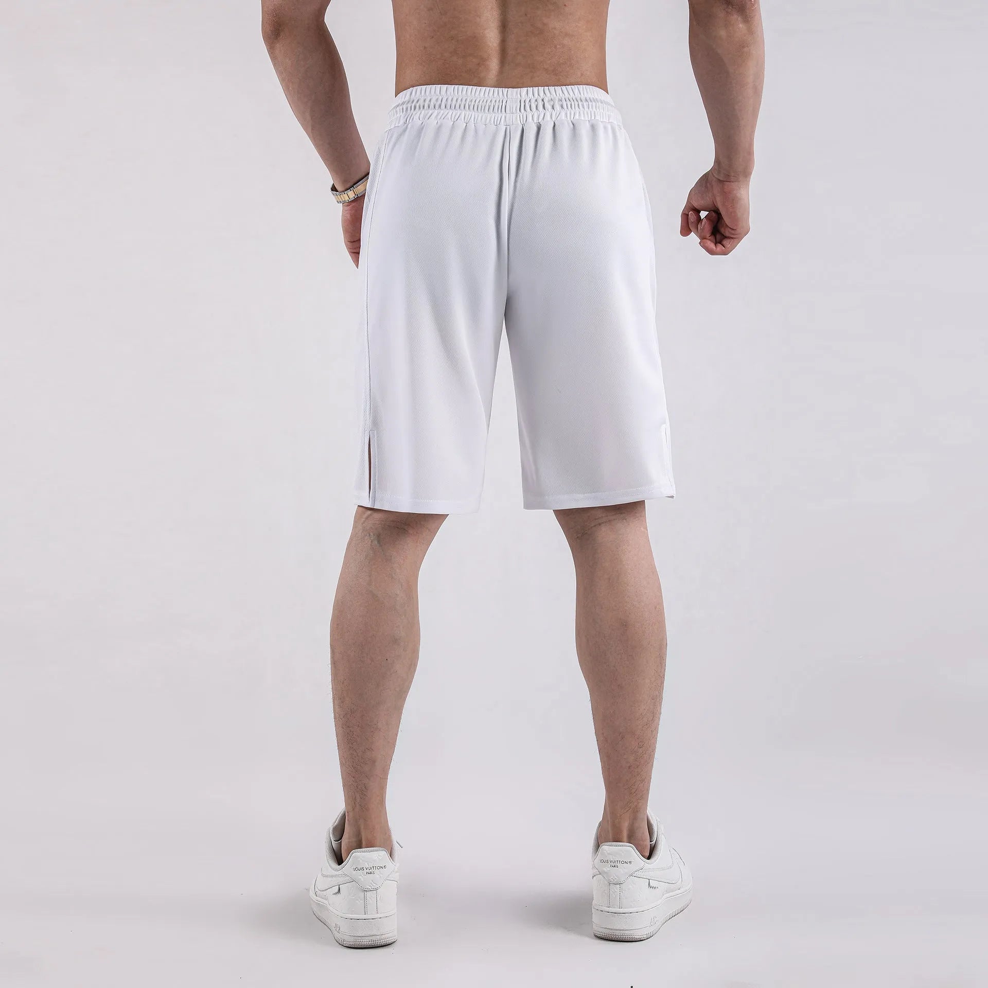 Men's black mesh capri shorts with elastic waistband and loose fit design