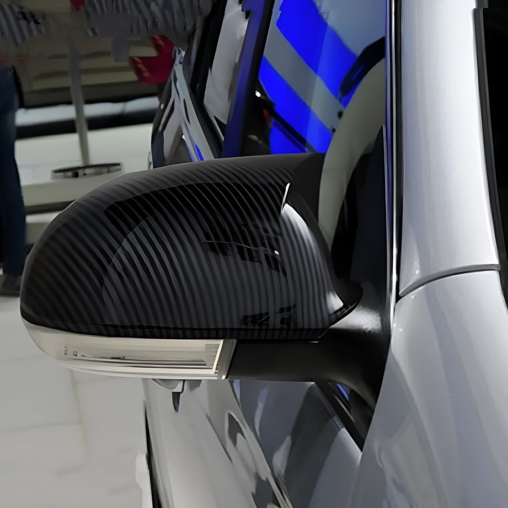 Pair of horn bright black plastic reflector shells for Volkswagen Sagitar side mirrors.
