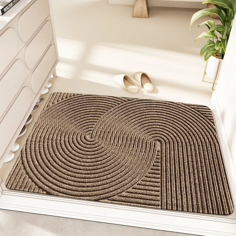 Green alien-shaped floor mat with cartoon pattern, measuring 60 by 90 cm with a wire ring border.