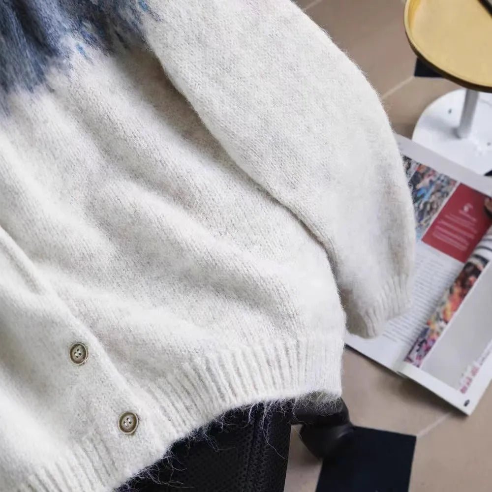 Women's jacquard-knit sweater coat in a contrast colour design with long sleeves.