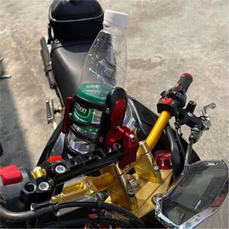 Black water bottle cage mounted on Honda X-ADV scooter bumper