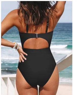 Women's solid colour cross-back one-piece swimsuit in black, red, or blue.