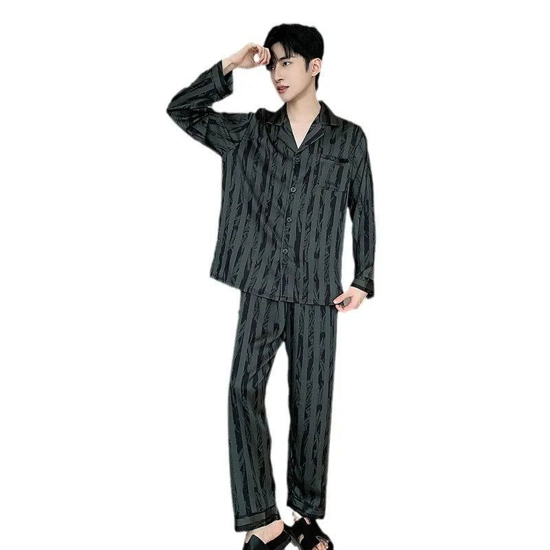 Men's black striped Ice Silk pajama set with long sleeves and trousers laid flat
