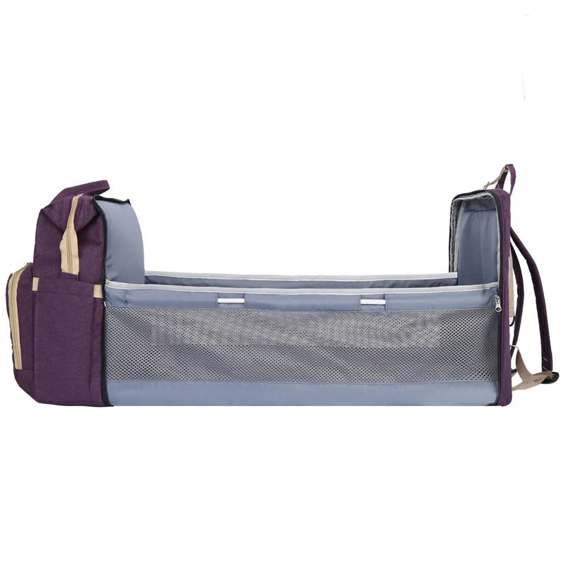 Portable folding mummy bag in multiple colours with a USB port and curved shoulder strap.