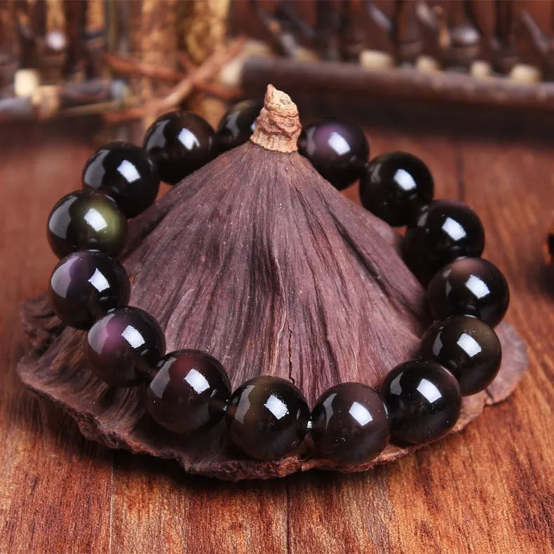 Crystal natural icy obsidian Pi Xiu bracelet with geometric ethnic design on wrist