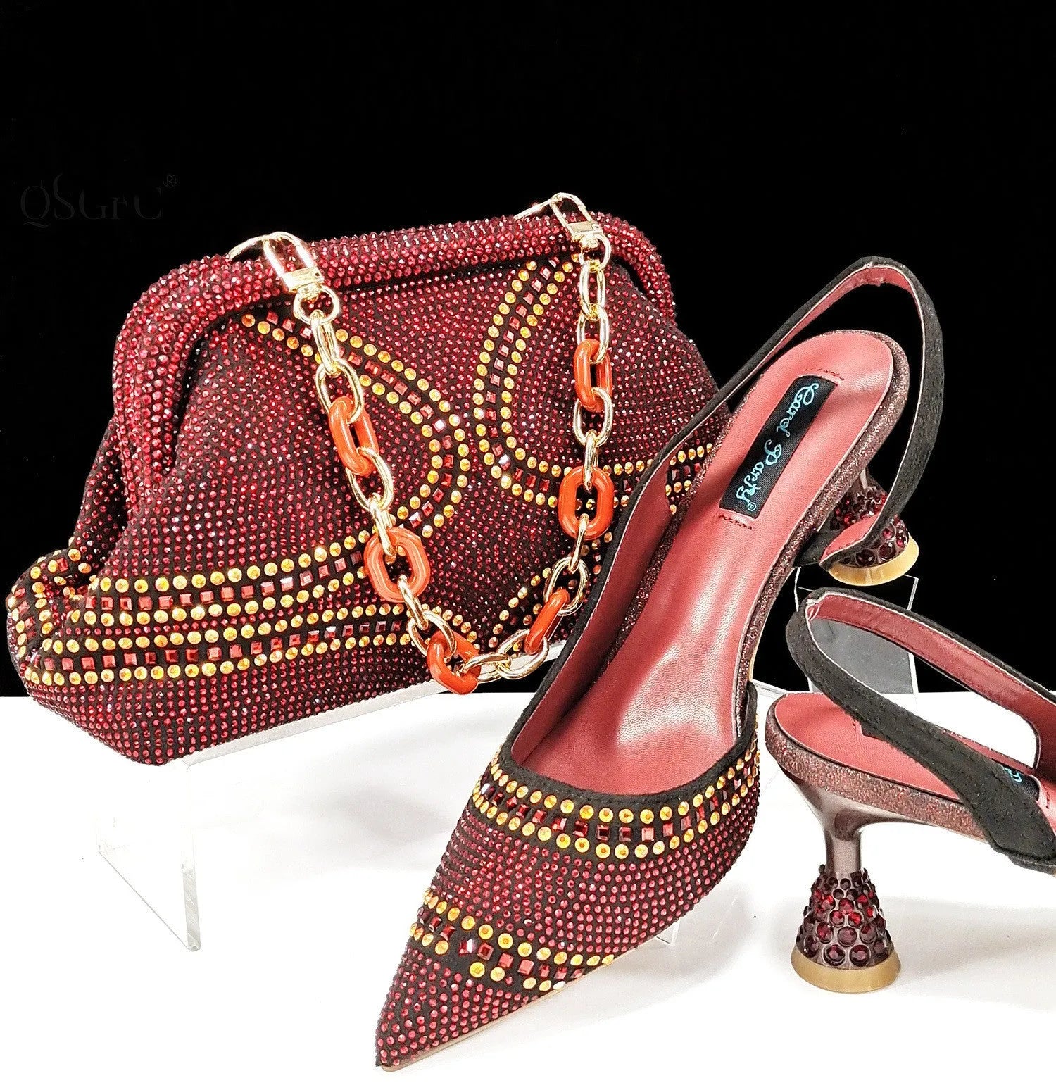 Women's pointed toe high heels with wine glass heel and matching small bag in blue colour.