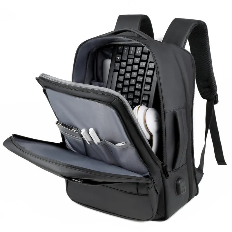 Black Oxford cloth business backpack with shoulder straps showing 20-35L capacity