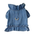 Blue denim vest dress for dog with ruffle trim and metal leash hook on chest.