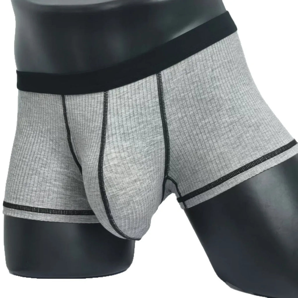 Men's solid colour boxers showing hip lifting and body shaping design in breathable fibre fabric
