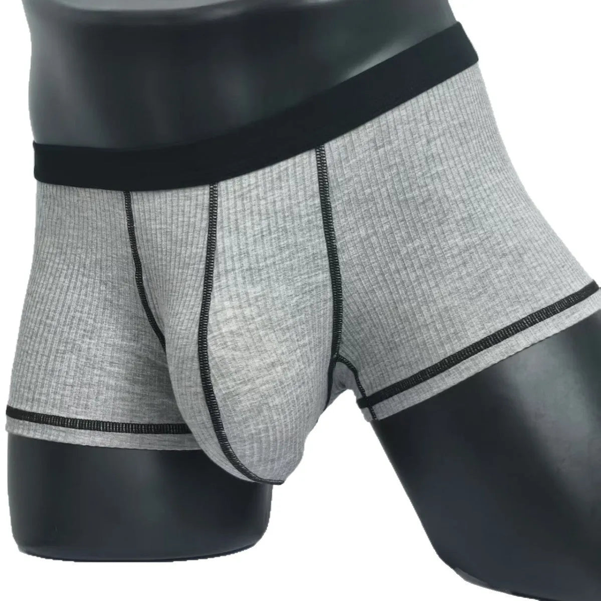 Men's solid colour boxers showing hip lifting and body shaping design in breathable fibre fabric