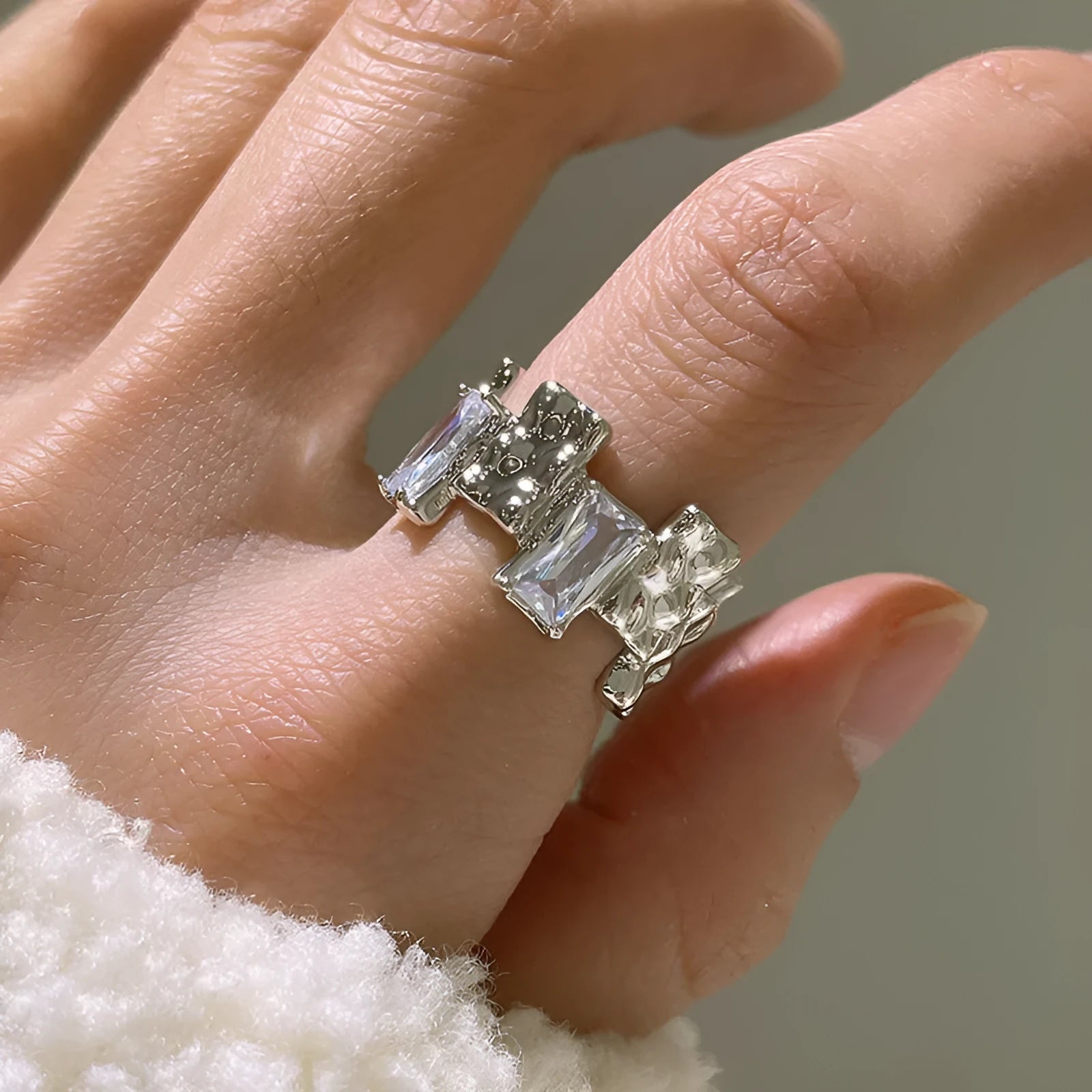 Silver geometric ring with cross zircon centre and open adjustable back