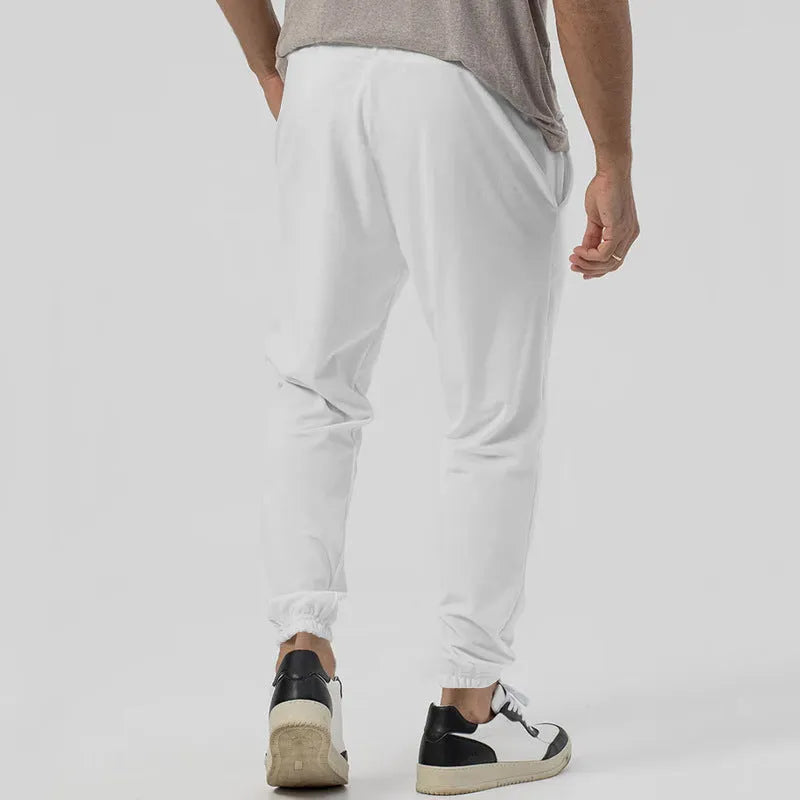 Men's gray cotton blend track sweatpants with loose tapered fit and straight-leg style