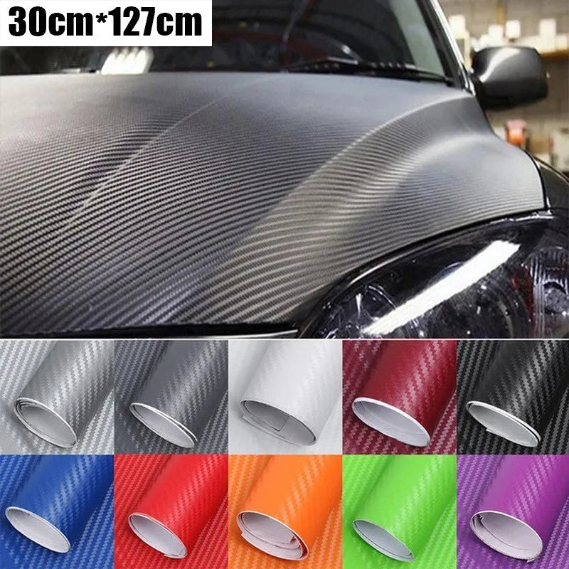 Roll of 3D carbon fibre car sticker showing black, silver, blue, and yellow colour options
