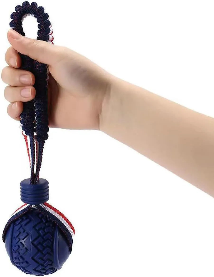 Blue or red natural rubber dog ball with attached rope for tug-of-war and teeth cleaning