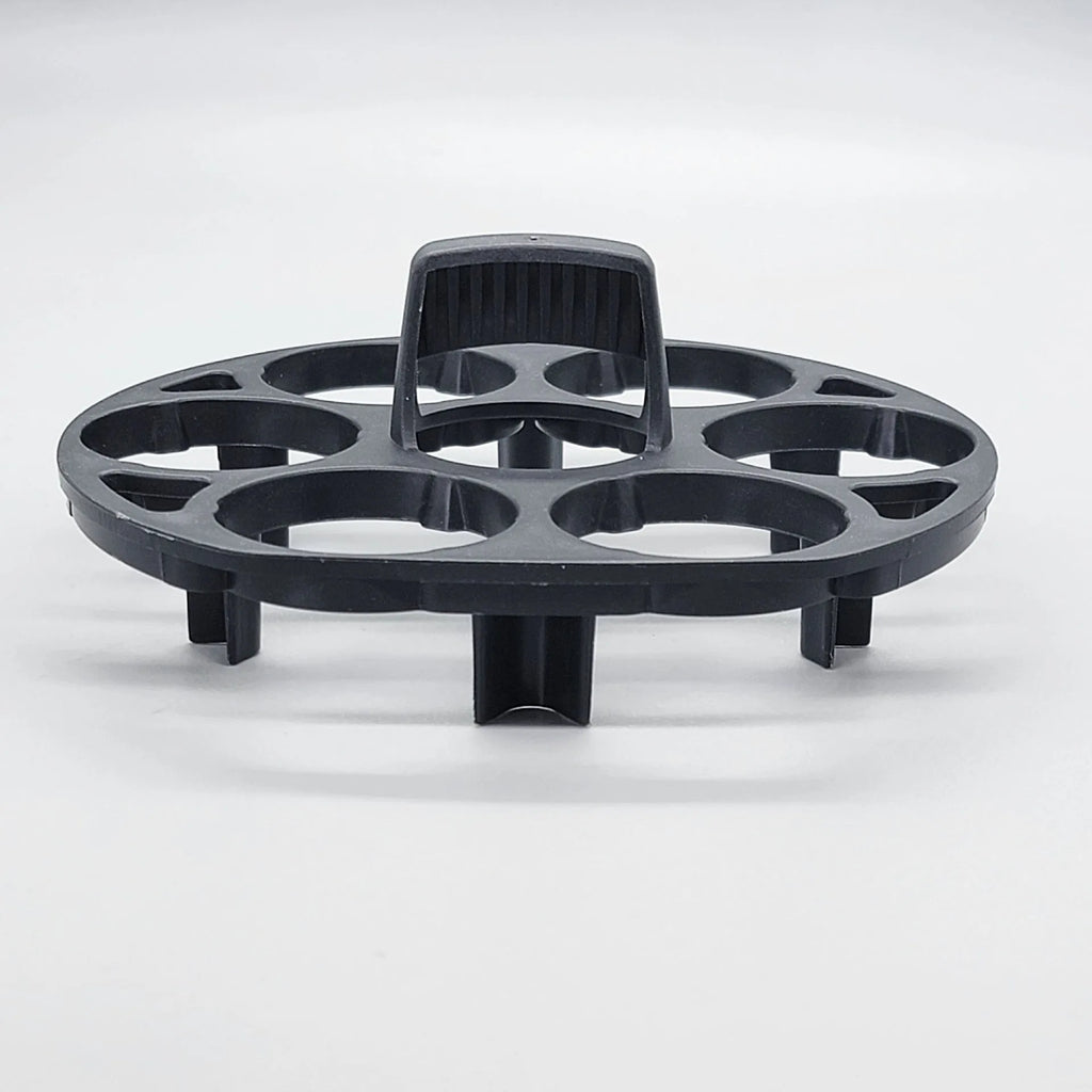 Black plastic egg holder rack with modern design for kitchen organisation.