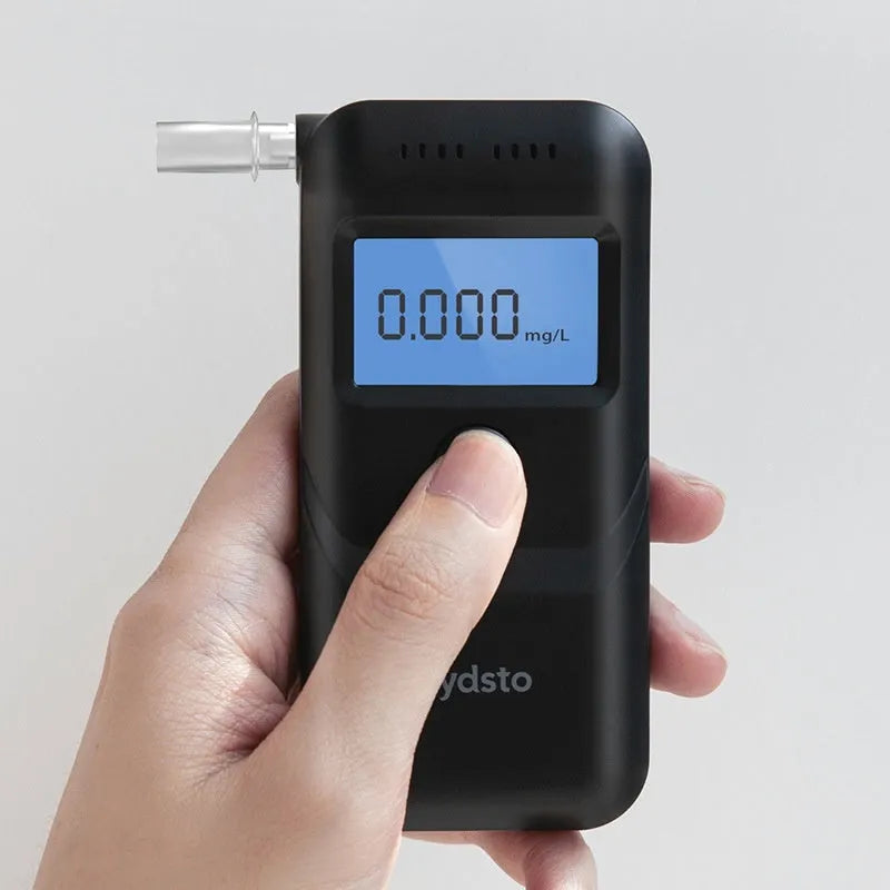 Black household alcohol tester with breath checking and height detection functions