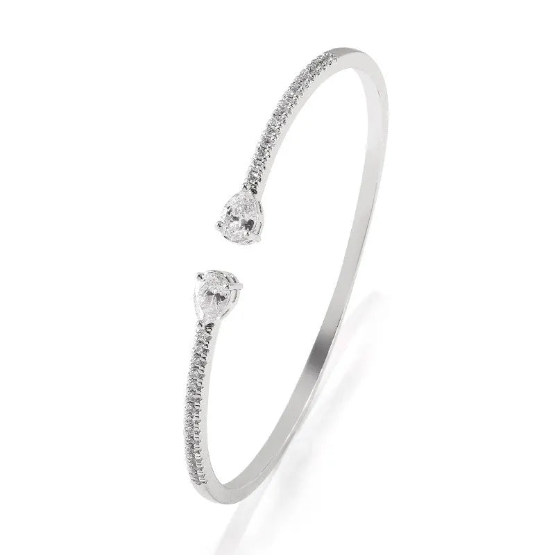 Copper bracelet with zircon inlay in simple design available in white or blue colour options