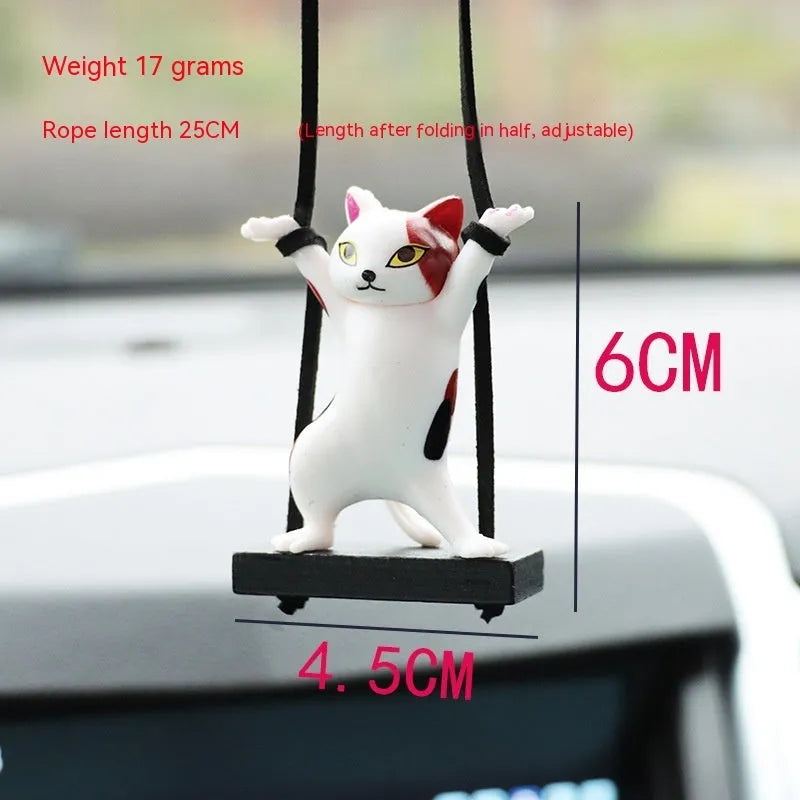 Cartoon-style resin cat pendant car ornament with adjustable rope in colour options including black, white, floral, grey, and brown.