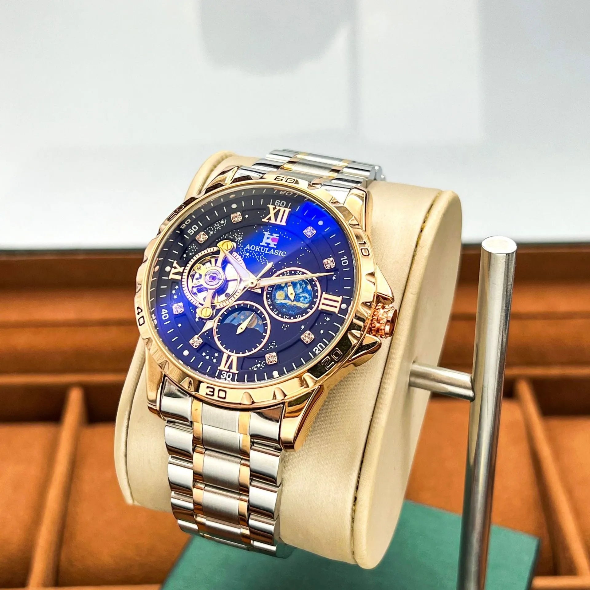 Men's automatic mechanical watch with rose gold casing, black dial, and large display