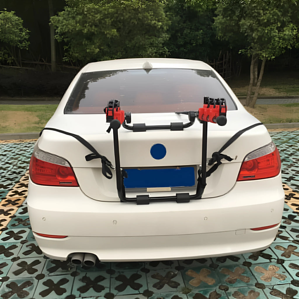 Black and red trunk mounted car bike rack with iron frame and plastic components