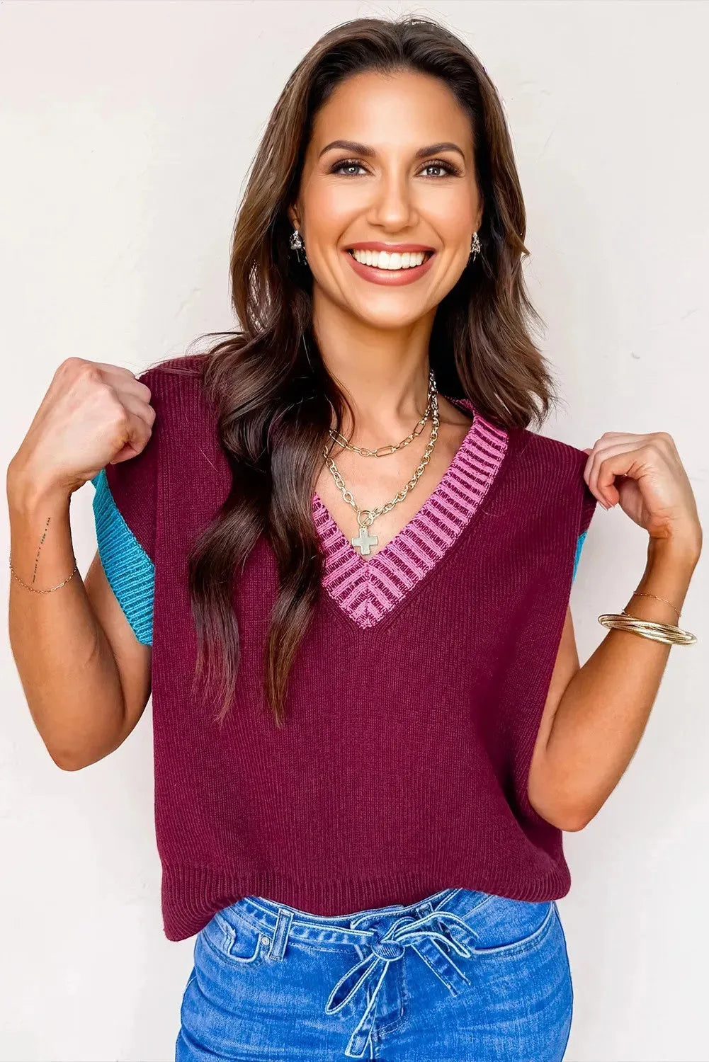 Burgundy women's V-neck sweater with white trim on collar and short sleeve cuffs