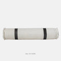 Modern minimalist bed runner set with blanket, pillowcase and leather round pillow on bed