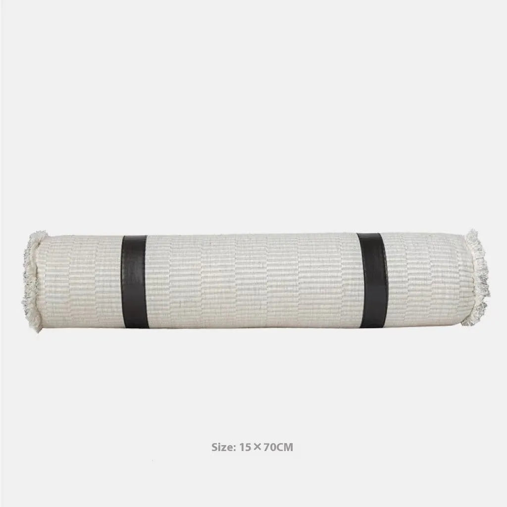 Modern minimalist bed runner set with blanket, pillowcase and leather round pillow on bed