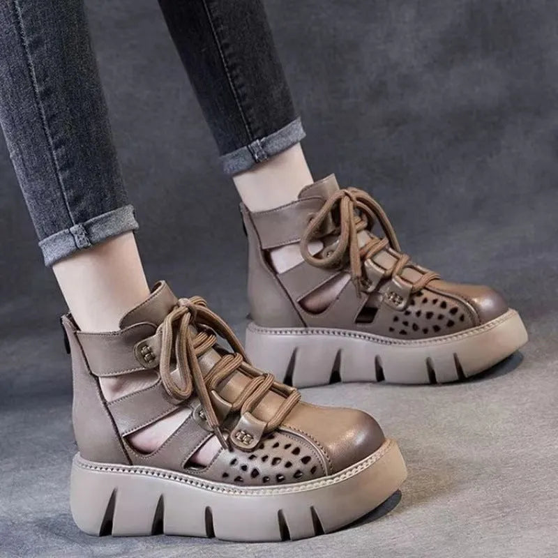 Women's black platform sandals with hollow hole design and fish-mouth toe, made from soft cowhide leather.