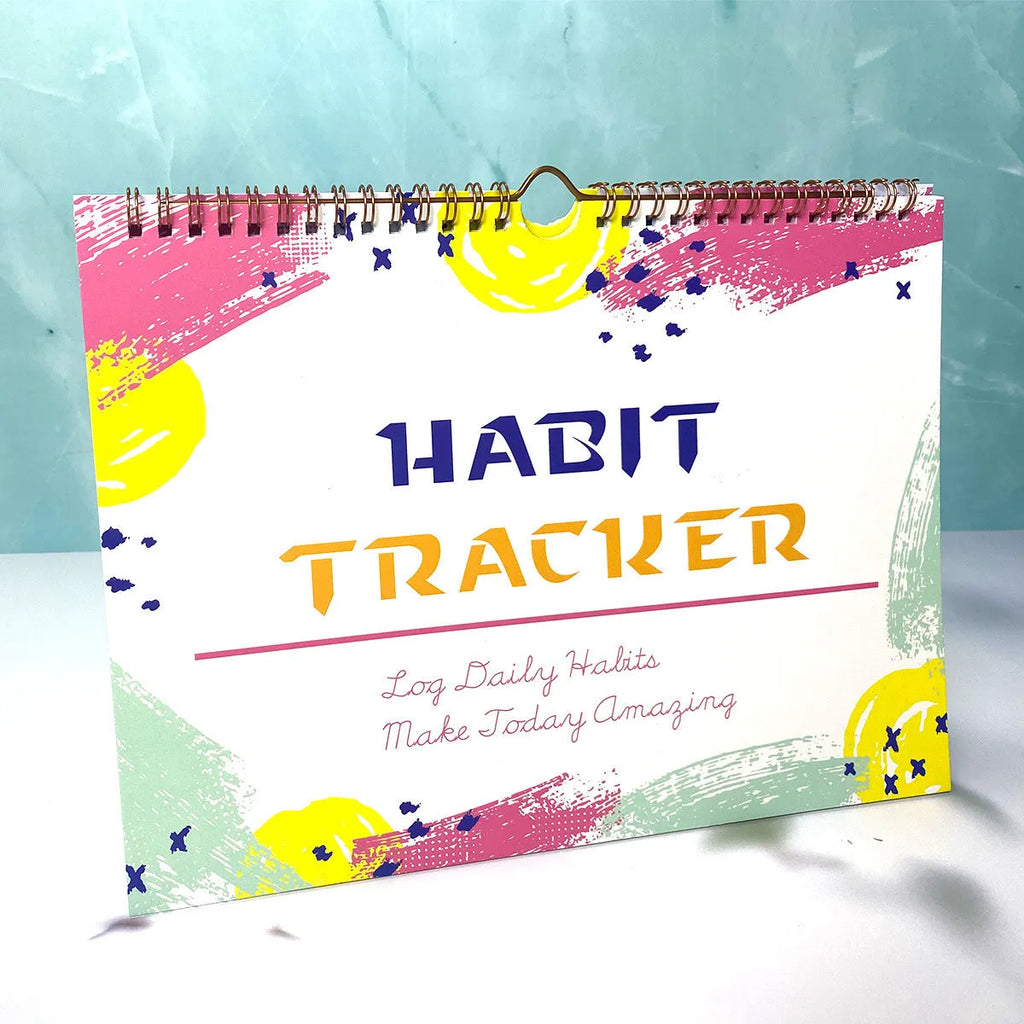 Habit tracking notebook open showing internal pages with 21x28cm dimensions in flower white cover colour