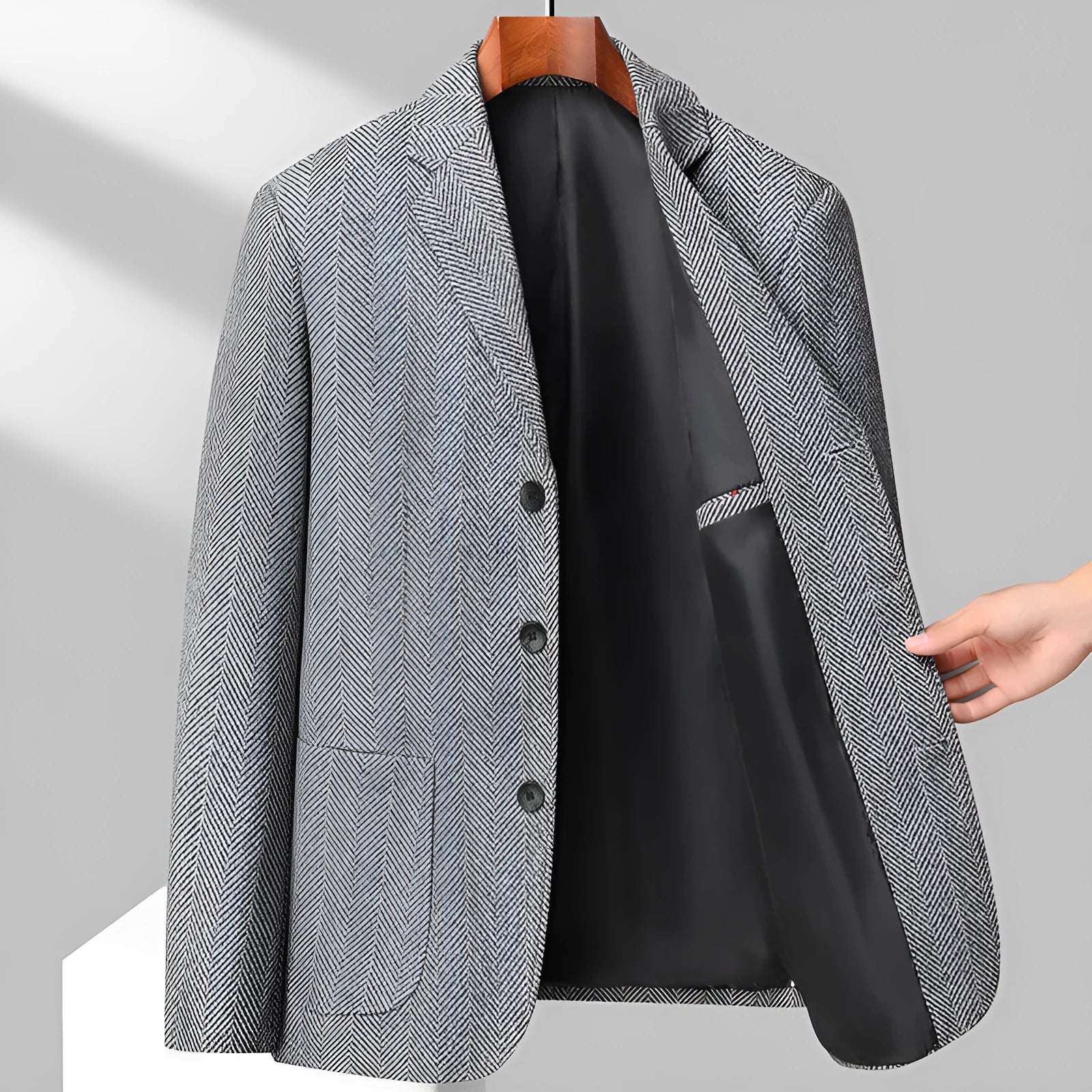 Men's loose fit solid colour woolen coat in black, shown on a model for casual autumn wear.