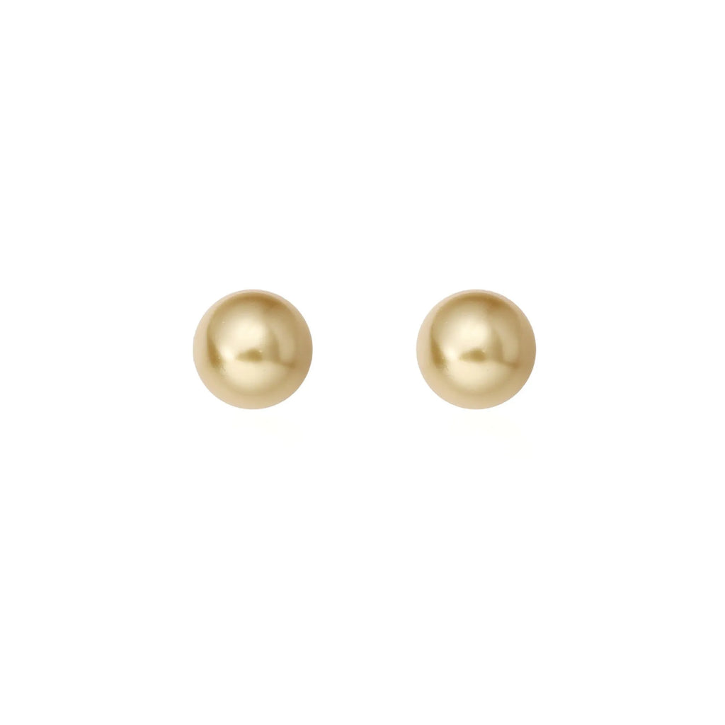A pair of large geometric pearl stud earrings with an eight-awn star detail on silver settings.
