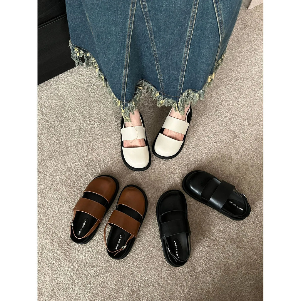 Retro apricot women's sandals with a raised sole, closed toe, and an adjustable ankle strap buckle.