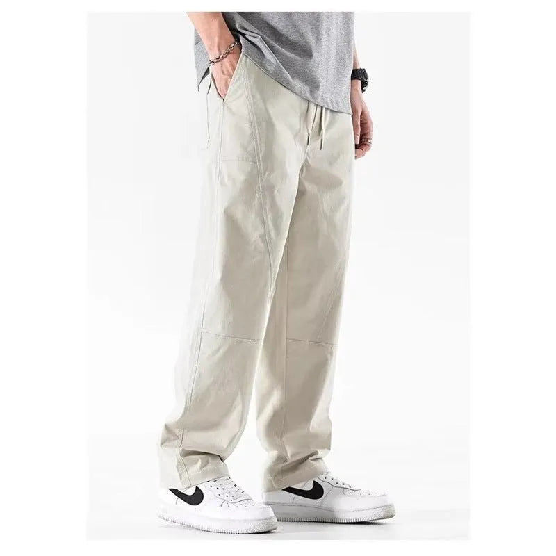 Women's milky white antibacterial cotton wide-leg casual trousers on a hanger.