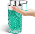 Silver automatic sensor soap dispenser with USB-C charging port on a bathroom counter.