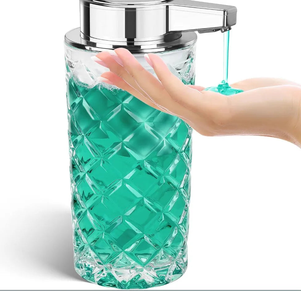 Silver automatic sensor soap dispenser with USB-C charging port on a bathroom counter.