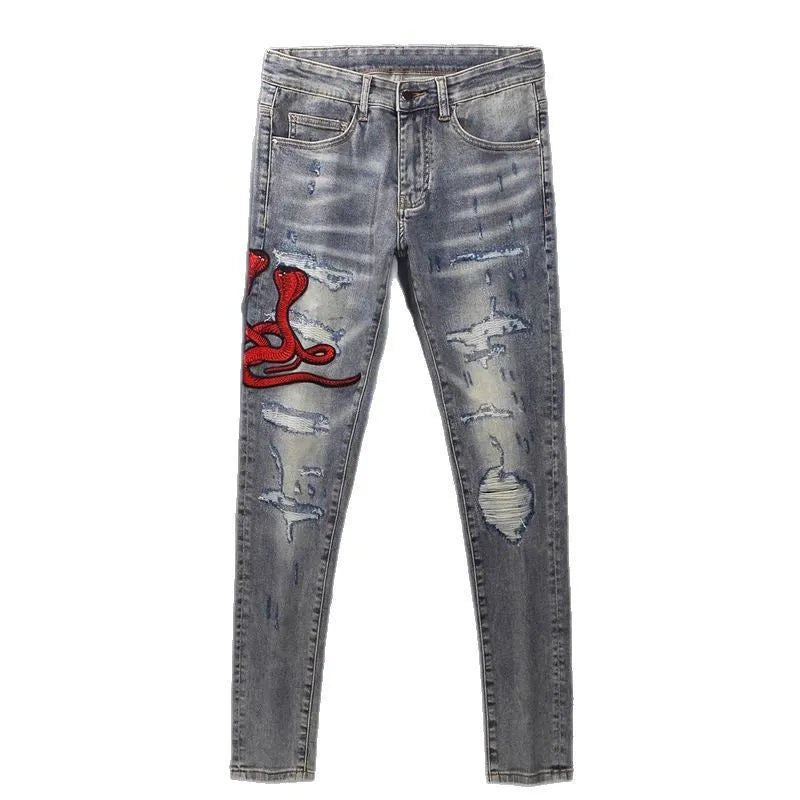 Men's washed-out slim fit jeans with patch detailing and embroidered branding on micro-elastic cotton