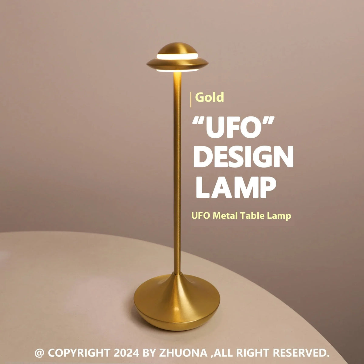 Metallic gold UFO-shaped table lamp with touch dimming on a wooden desk.