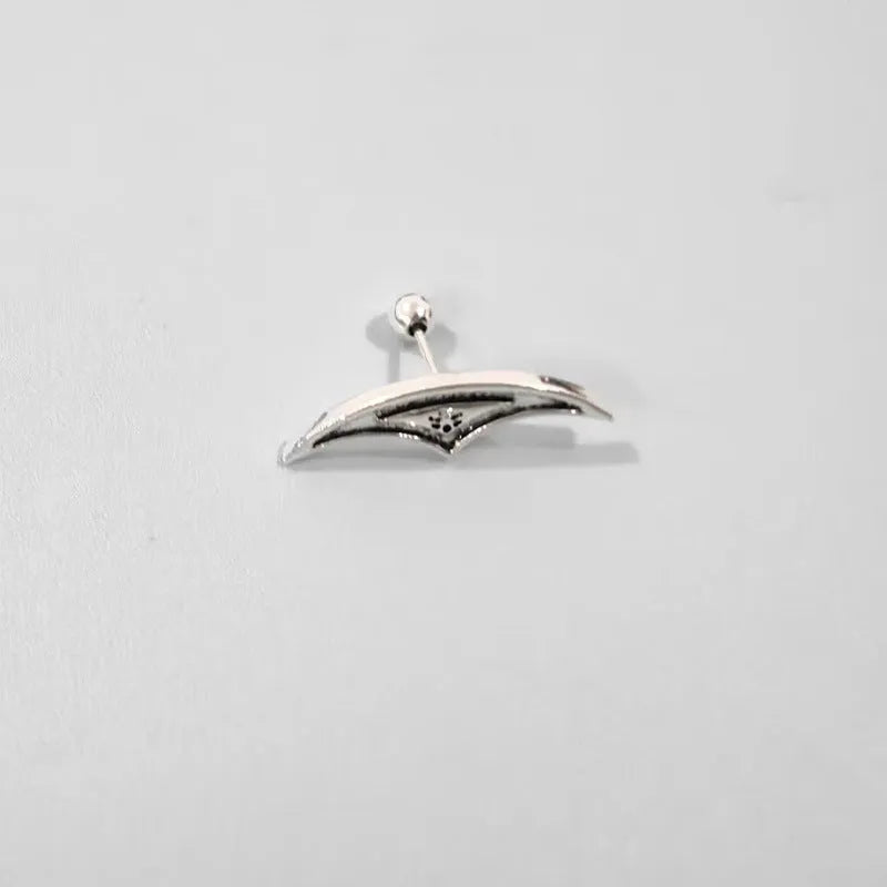 Geometric spider web design stud earrings in gold and silver electroplated metal.