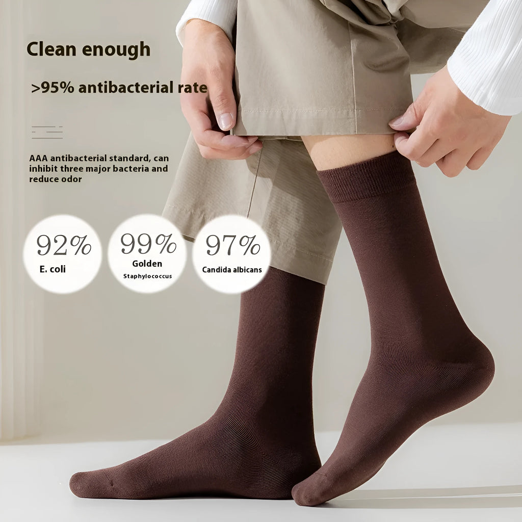 Mid-calf business socks in pure combed cotton showing solid colour options including army green, beige and black