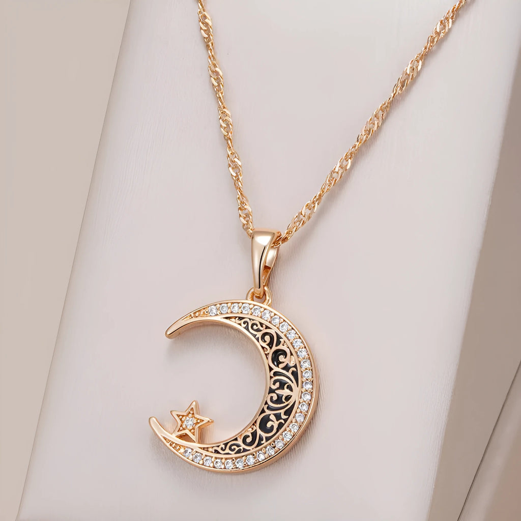 Rose gold star moon pendant necklace with zircon and enamel details on adjustable water wave chain