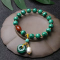 Natural malachite and southern red agate bracelet with 7-8mm round barrel beads on wrist